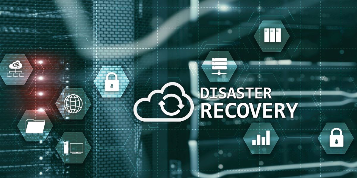 IT manager reviewing Backup & Disaster Recovery dashboard in a server room